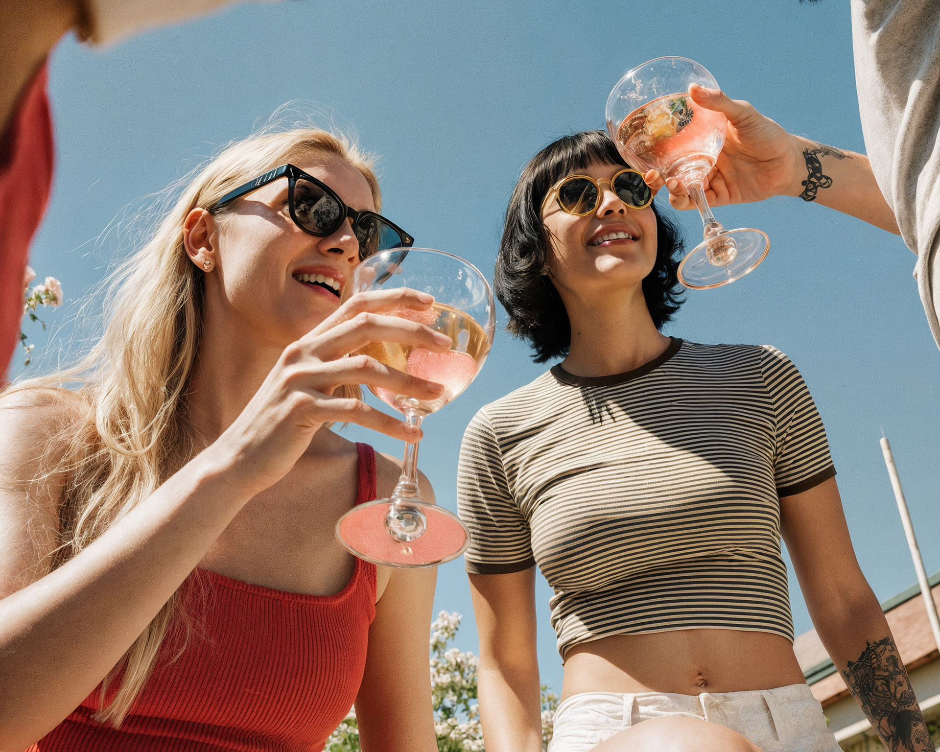 People enjoying Ratafia Almond Spirit Spritz drinks on a summer day.